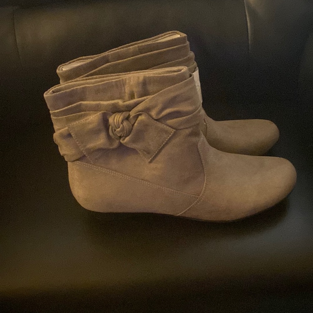 I am selling a Tan brown pair of boots size 8 $40 brand new never worn